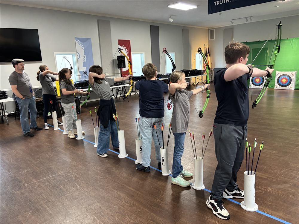 Club students on the shooting line at The King&rsquo;s Academy during a Fall 2026 Thursday club night